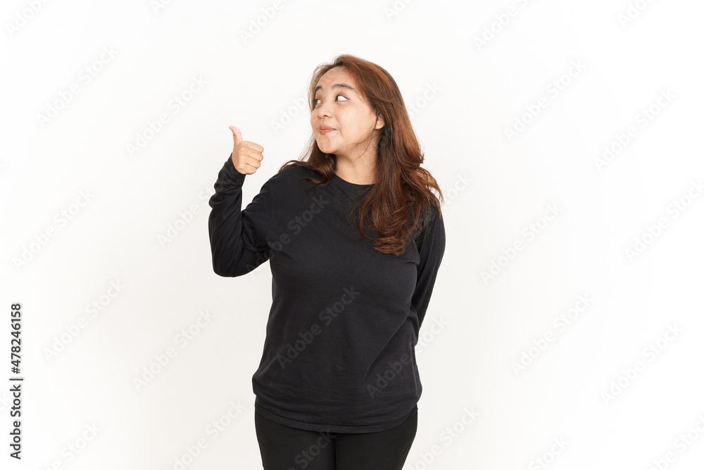 Showing and Pointing Aside with Thumb Of Beautiful Asian Woman Wearing Black Shirt Showing and Pointing Aside with Thumb Of Beautiful Asian Woman Wearing Black Shirt