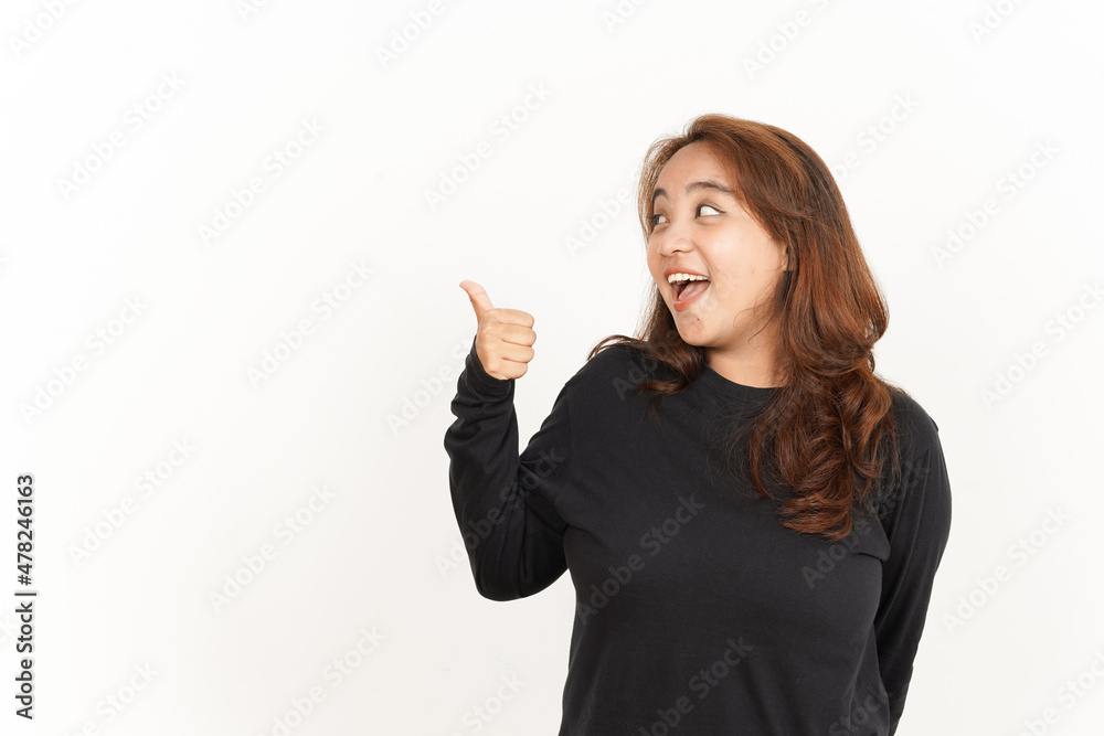 Showing and Pointing Aside with Thumb Of Beautiful Asian Woman Wearing Black Shirt Showing and Pointing Aside with Thumb Of Beautiful Asian Woman Wearing Black Shirt