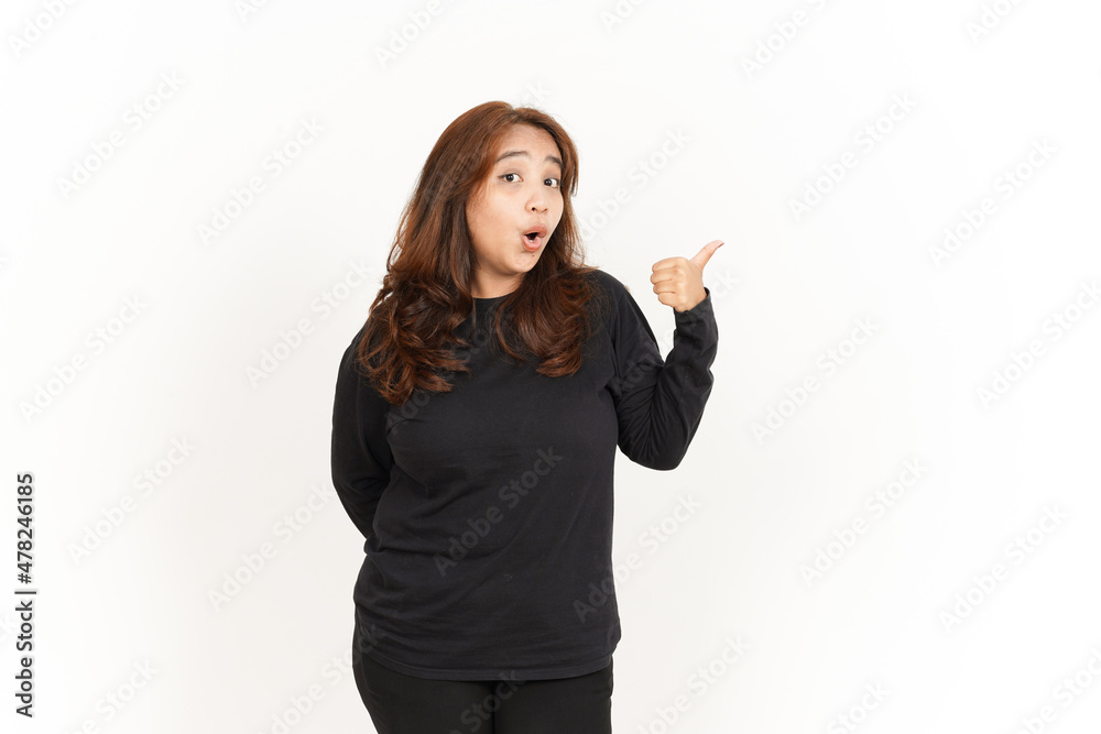 Showing and Pointing Aside with Thumb Of Beautiful Asian Woman Wearing Black Shirt Showing and Pointing Aside with Thumb Of Beautiful Asian Woman Wearing Black Shirt