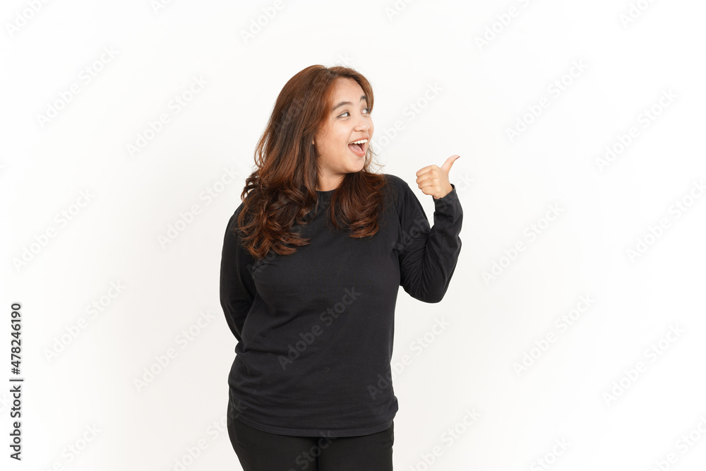 Showing and Pointing Aside with Thumb Of Beautiful Asian Woman Wearing Black Shirt Showing and Pointing Aside with Thumb Of Beautiful Asian Woman Wearing Black Shirt