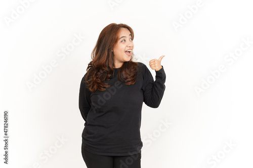 Showing and Pointing Aside with Thumb Of Beautiful Asian Woman Wearing Black Shirt