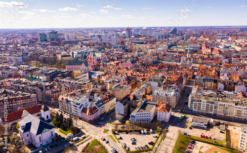 Aerial view of Poznan modern cityscape overlooking new residential areas and historical center on sunny spring day, Poland photo