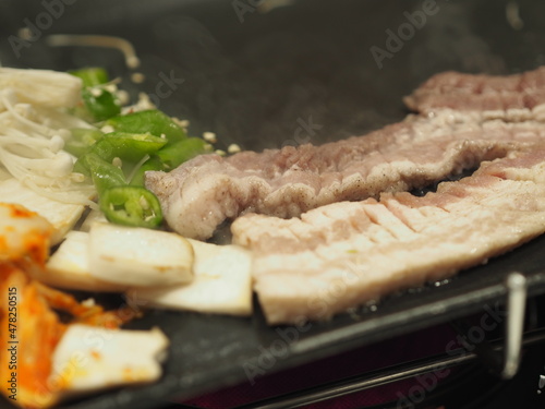 grilled pork is on the pan in Thai style, Thai buffet with pork, chicken and other meats barbecue pan, pork grill, Bar-B-Q, Thai Barbecue, Korean Barbecue in Thai Style, Thai Barbecue Buffet