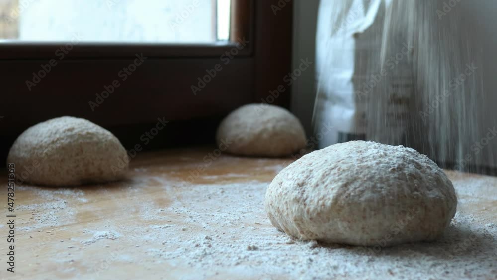 preparing pizza with wholemeal flour, shallow depth of field and natural light, close up shot preparing pizza with wholemeal flour, shallow depth of field and natural light, close up shot