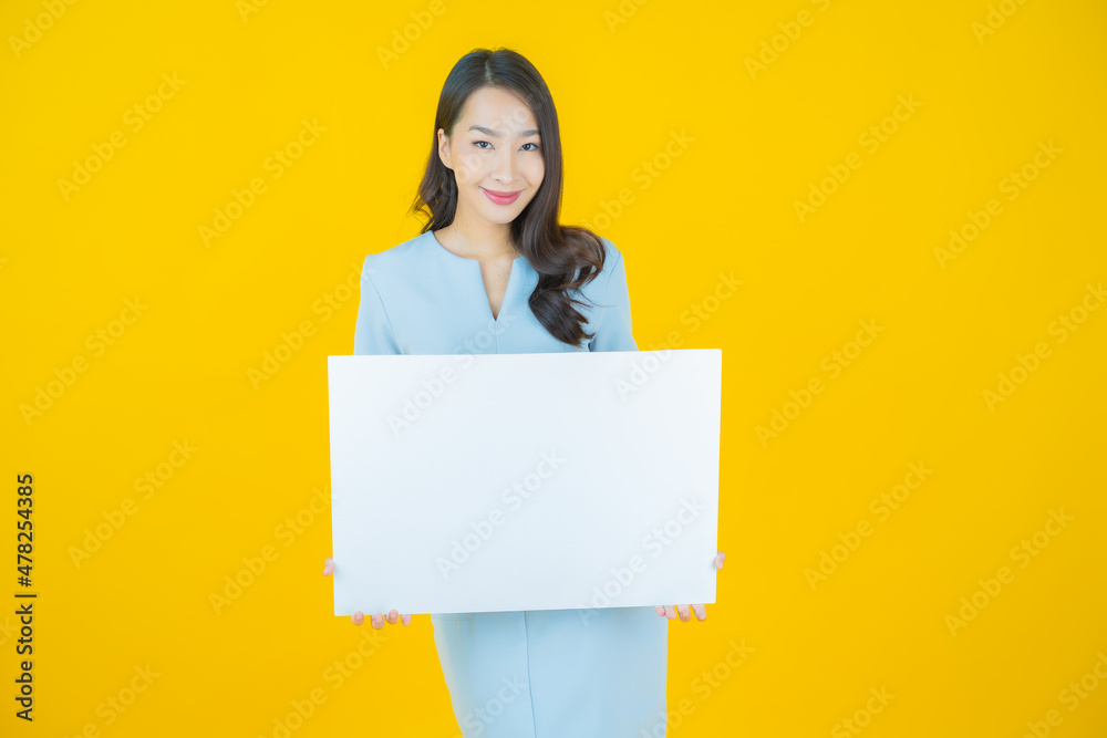 Portrait beautiful young asian woman with empty white billboard Portrait beautiful young asian woman with empty white billboard