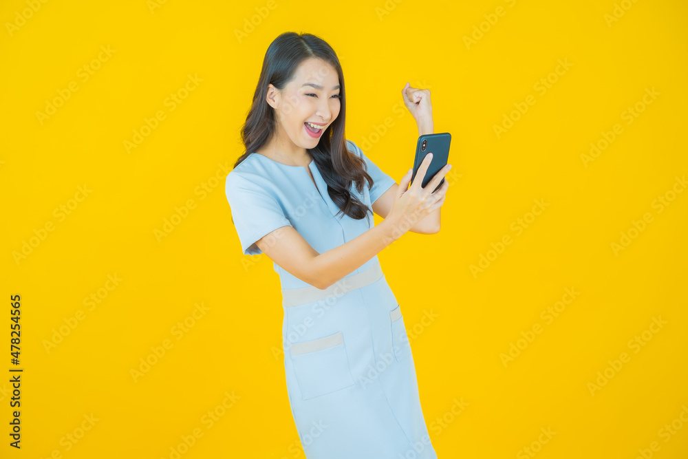 Portrait beautiful young asian woman smile with smart mobile phone Portrait beautiful young asian woman smile with smart mobile phone