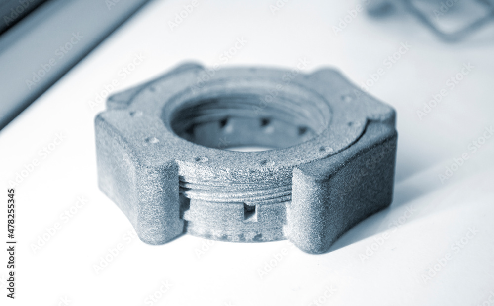 Gray model printed on 3d printer from powder on white background close-up. 3D prototype created by additive 3d printing technology. Multi Jet Fusion MJF. Concept new modern hi-technology 3d printing Gray model printed on 3d printer from powder on white background close-up. 3D prototype created by additive 3d printing technology. Multi Jet Fusion MJF. Concept new modern hi-technology 3d printing