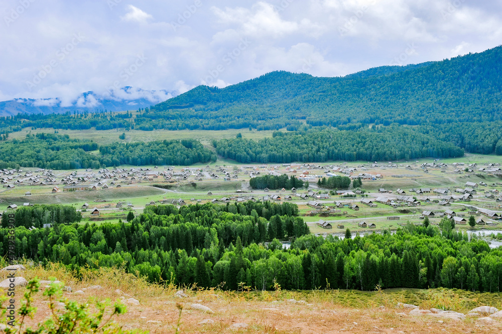 Mountains and forests surround the natural scenery of Hemu village in Kanas, Xinjiang, China Mountains and forests surround the natural scenery of Hemu village in Kanas, Xinjiang, China