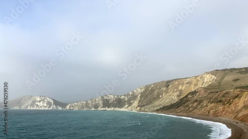 Aerial view panning across a beautiful coastal landscape in England photo