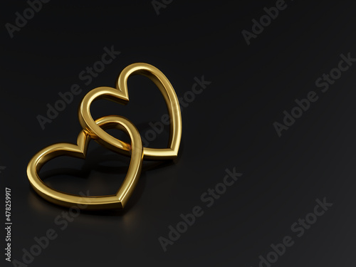 Foto Valentine concept gold pendant that is linked together on black background with