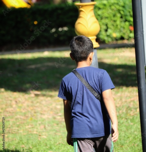 boy walking in the park
