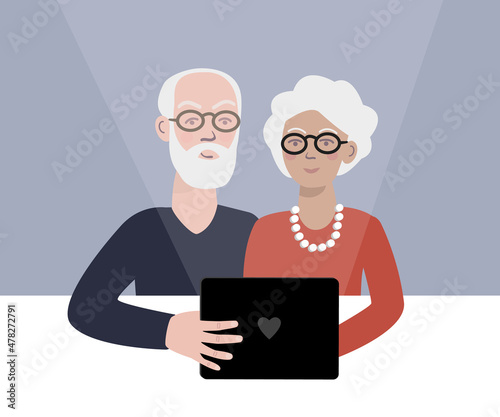 Elderly couple using tablet, taking photo. Senior citizens using modern technology.