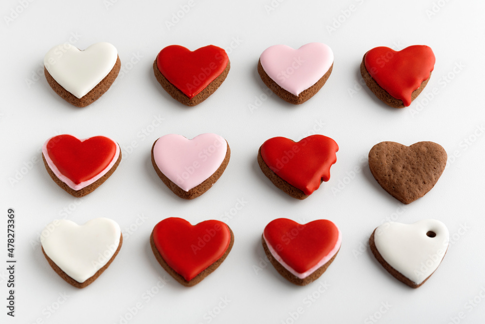 Background from many hearts shaped gingerbread. Valentines Day, white background. Mothers day.