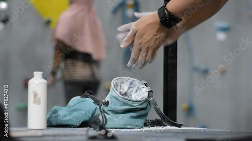 male hand using magnesium powder before climbing practice