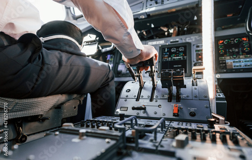 Control of the flight. Pilot on the work in the passenger airplane. Preparing for takeoff