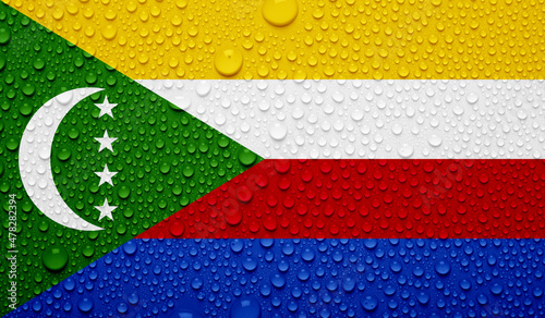 Comoros flag on water texture. 3D image photo