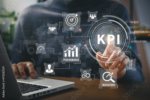 Businessman touching screen icon KPI Key Performance to measure achievement versus planned target