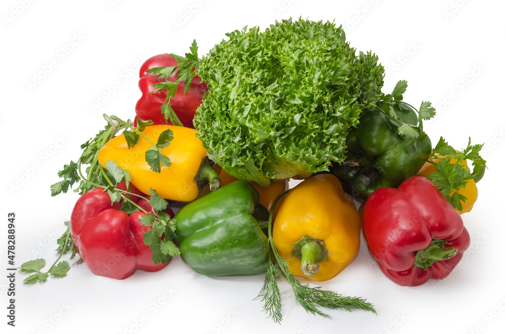 Bell peppers different colors and various greens on white background