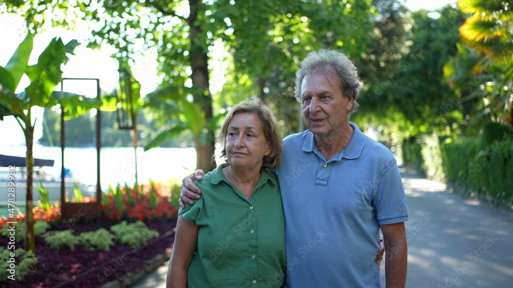 Senior couple standing outside together, 60s husband and wife Senior couple standing outside together, 60s husband and wife