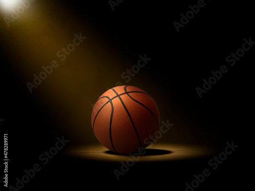 Basketball ball on the parquet with black background © Retouch man