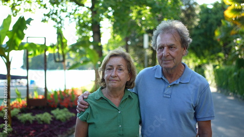 Senior couple standing outside together, 60s husband and wife