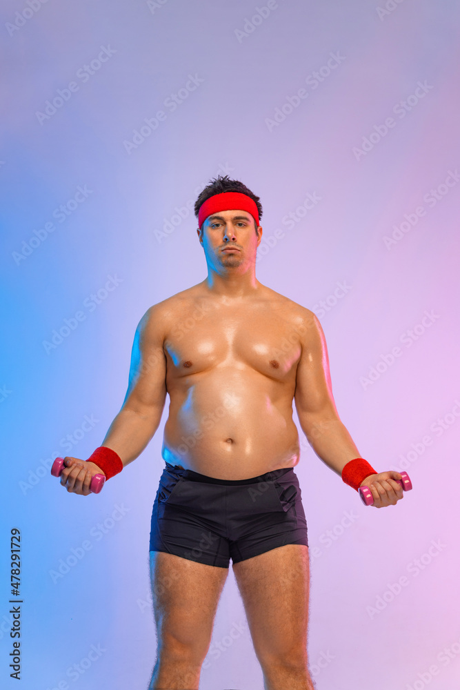 Fat man with dumbbells want to lose weight and become a slim athlete. Fitness concept.