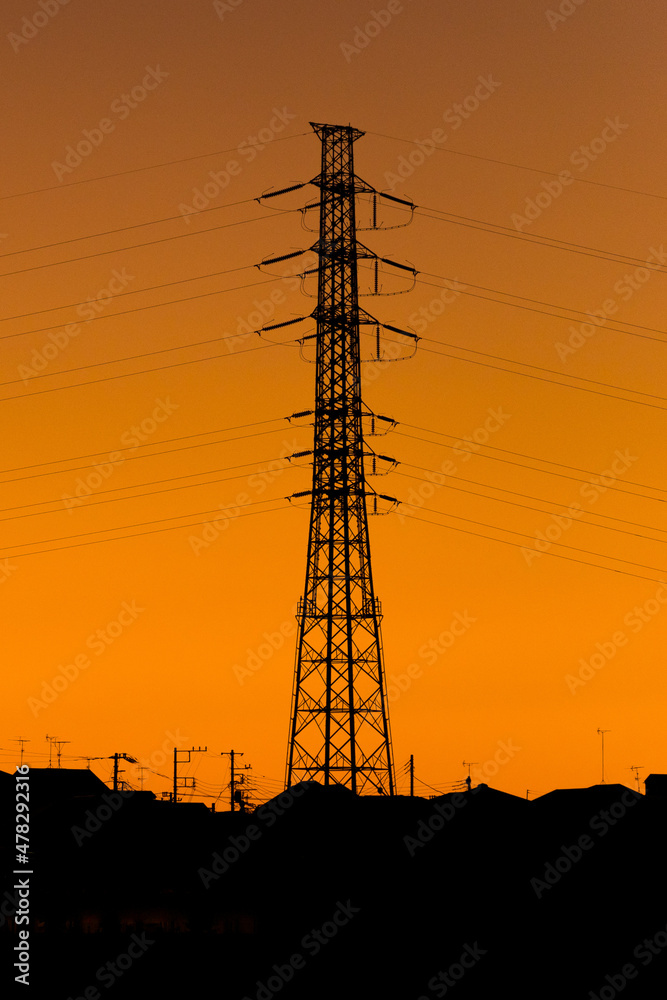 Fototapeta premium Silhouette of high voltage transmission tower