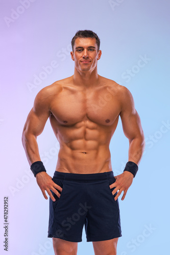 Man athlete isolated on color background. Gym full body workout. Muscular man athlete in fitness gym have havy workout. Sports trainer on trainging. Fitness motivation.