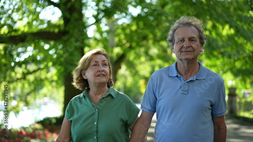 Happy senior couple walking together in afternoon walk