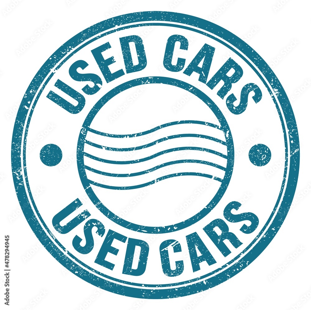 USED CARS text written on blue round postal stamp sign USED CARS text written on blue round postal stamp sign