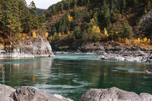 Mountain river surrounded by high rocks in Altai