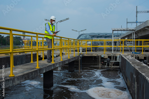 workers at work on Wastewater treatment plant.  Wastewater treatment concept. Service engineer on  waste water Treatment plant.