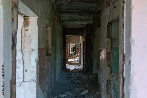 Abandoned kindergarten without children. An empty long corridor with traces of destruction and desolation in complete isolation © Александр Бочкала