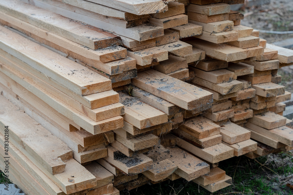 Close up photo of stack Of wooden planks on a storage Close up photo of stack Of wooden planks on a storage