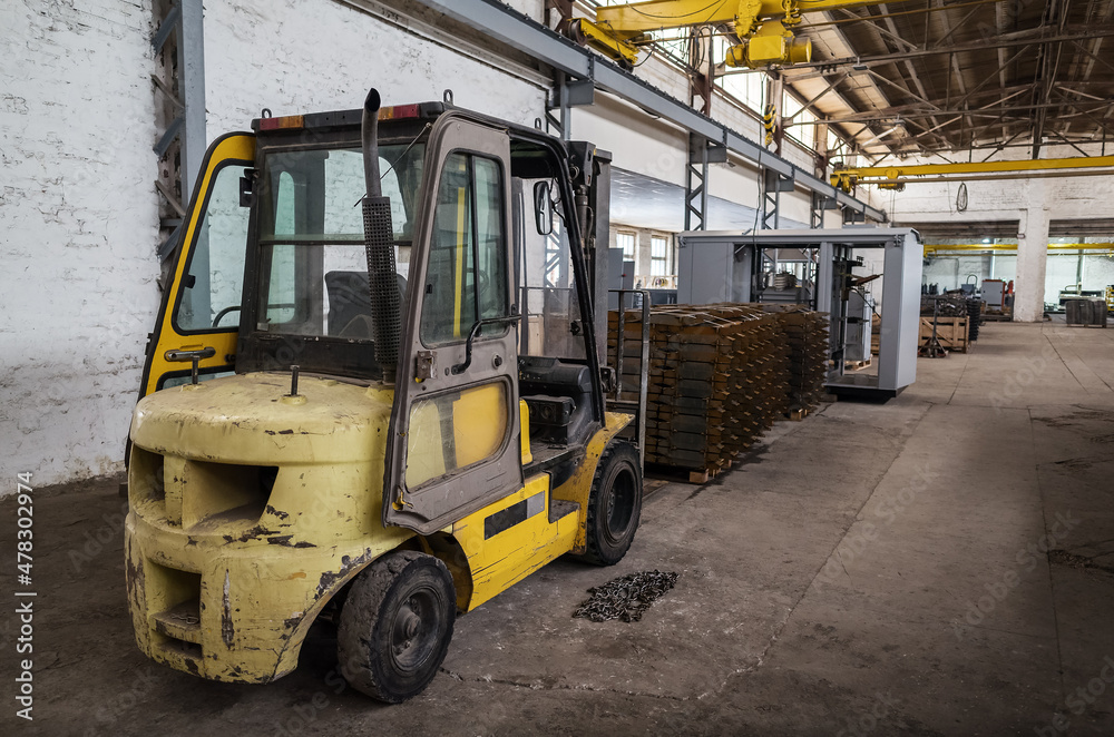 Forklift truck in a production area. The picture was taken in Russia, in the factory shop