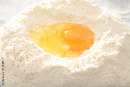 egg yolk on white flour for dough