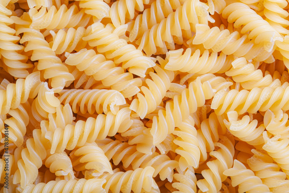 raw italian Pasta spiral background top view