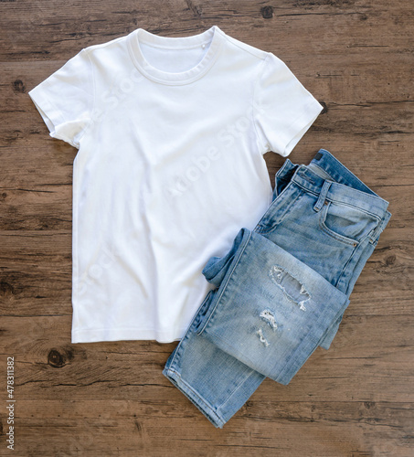 Photography White T-shirt and jeans mock up flat lay on wooden background