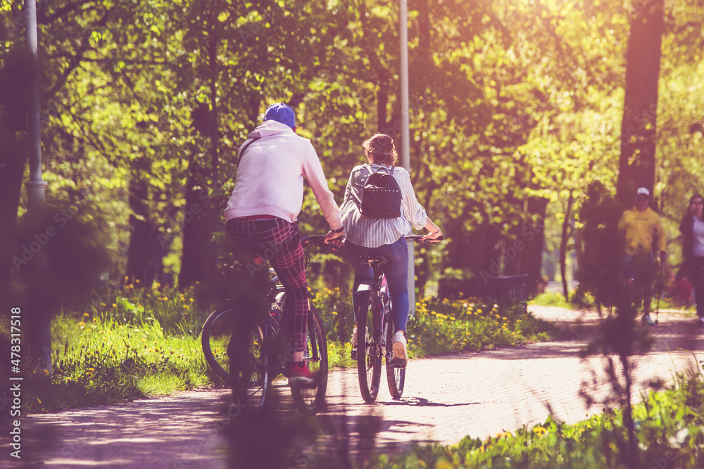 Cyclists ride on the bike path in the city Park
Cyclists ride on the bike path in the city Park