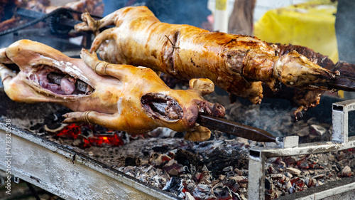 Whole pig and roasting on a spit