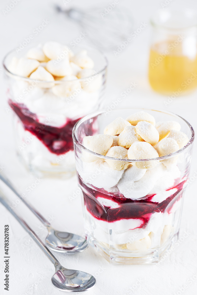 Vegan dessert with aquafaba meringue, coconut cream and cherry. Sugar and lactose free. Vegan dessert with aquafaba meringue, coconut cream and cherry. Sugar and lactose free.