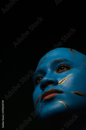 Bald man in blue makeup