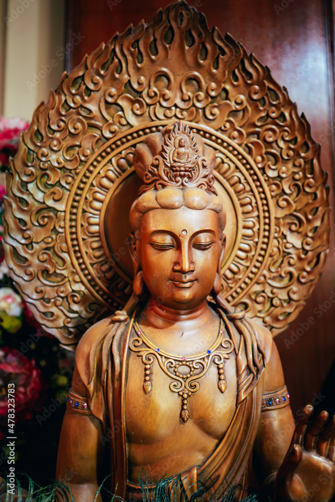Guanyin sculpture wood, At worship of temple Chinese.