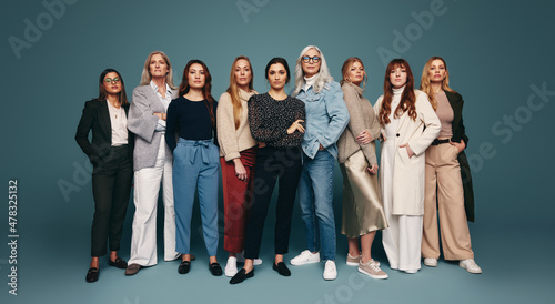 Group of strong independent women standing in a studio