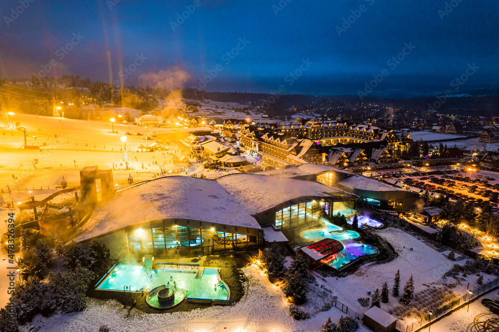 Bania Thermal Baths and Ski Resort Drone View at Winter Night, Poland - obrazy, fototapety, plakaty 