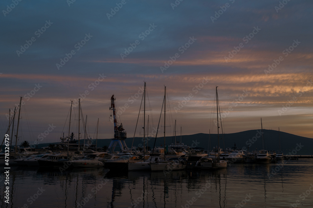 Dusk over the marina with moored yachts in Porto. Montenegro