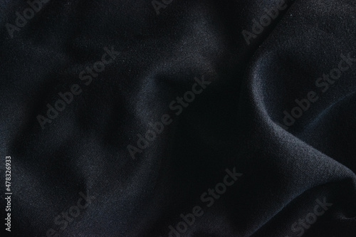 Close up photo of black textile, sweatshirt fabric.