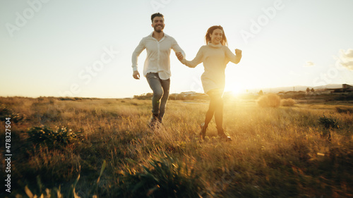 Couple Runs At Sunset.