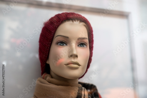 Closeup of woolen hat on mannequin in a fashion store showroom