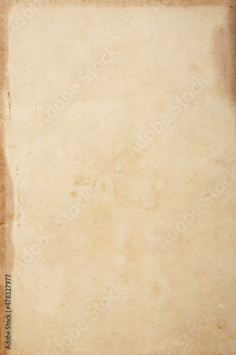 Old brown kraft paper background macro texture with stains